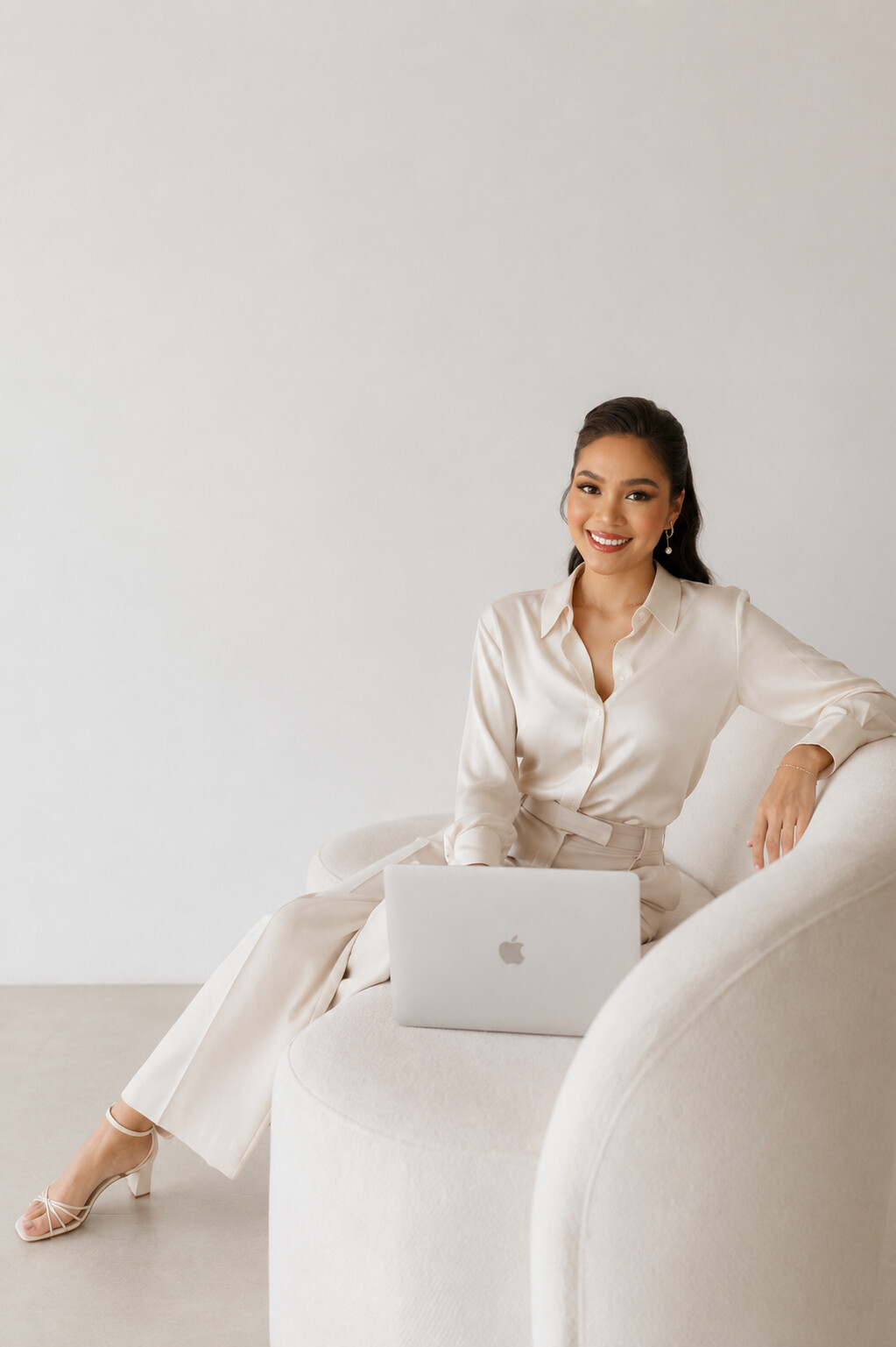 Lanie seated with her laptop